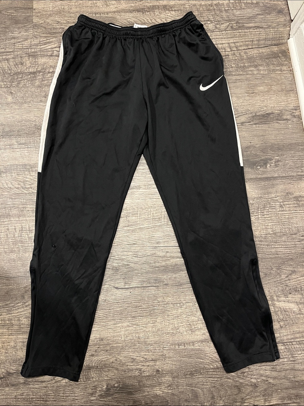 Nike Black Joggers with White Swoosh and Side Stripes